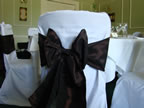 White Chair Covers and Chocolate Taffeta Sash